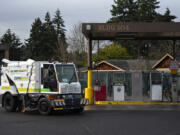Workers test drive an electric street sweeper past a shared fuel station at the city of Vancouver Public Works Office as seen Tuesday morning. Vancouver could be one of many Washington cities that incorporate zero-emission vehicles into municipal fleets.