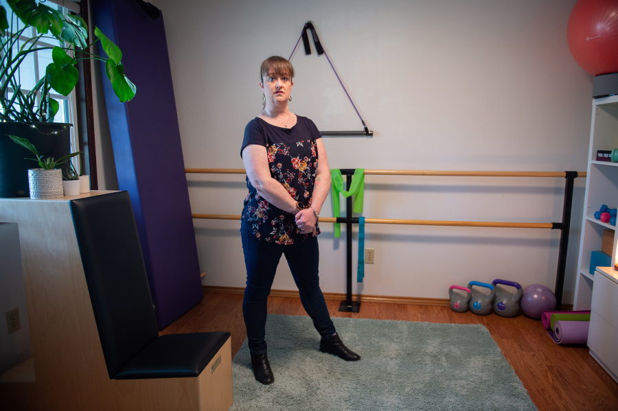 Jenny Bevard stands in her wellness room that she created after being diagnosed with long COVID as a space to focus on both her mental and physical health.
