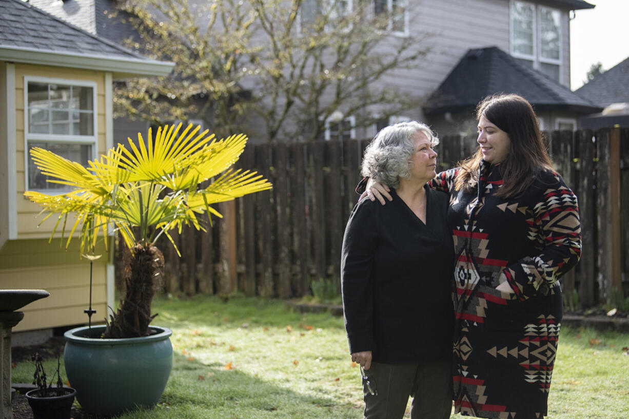 Susan Martin, left, shares a quiet moment with her daughter, Jennifer Leow, as they take a break at her Vancouver home. Martin was diagnosed with endometrial cancer in 2021 and has been participating in the trials of a new drug at Legacy Health to treat advanced or recurring cases of endometrial cancer.