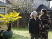 Susan Martin, left, shares a quiet moment with her daughter, Jennifer Leow, as they take a break at her Vancouver home. Martin was diagnosed with endometrial cancer in 2021 and has been participating in the trials of a new drug at Legacy Health to treat advanced or recurring cases of endometrial cancer.