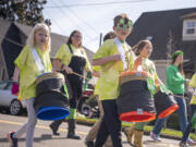 Hough Elementary School students play drums and march Friday during the Paddy Hough Parade in Vancouver.
