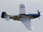 After World War II, several surplus Mustang F-51 fighters like this one were assigned to the Oregon Air National Guard. One spun into Vancouver Lake in 1951, nearly causing a news blackout. During the lake's dredging, olive-drab airplane parts were recovered thirty years later. Mysteriously they belonged to an Aircobra P-39.