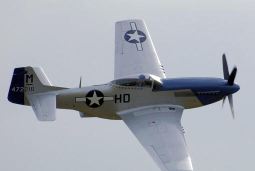 After World War II, several surplus Mustang F-51 fighters like this one were assigned to the Oregon Air National Guard. One spun into Vancouver Lake in 1951, nearly causing a news blackout. During the lake's dredging, olive-drab airplane parts were recovered thirty years later. Mysteriously they belonged to an Aircobra P-39.