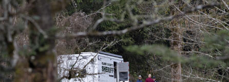 Law enforcement officials work at the scene along Wooding Road east of Washougal on Wednesday afternoon, March 22, 2023. Authorities found two bodies believed to be those of a missing Vancouver woman and her 7-year-old daughter in a brushy area farther down Wooding Road.