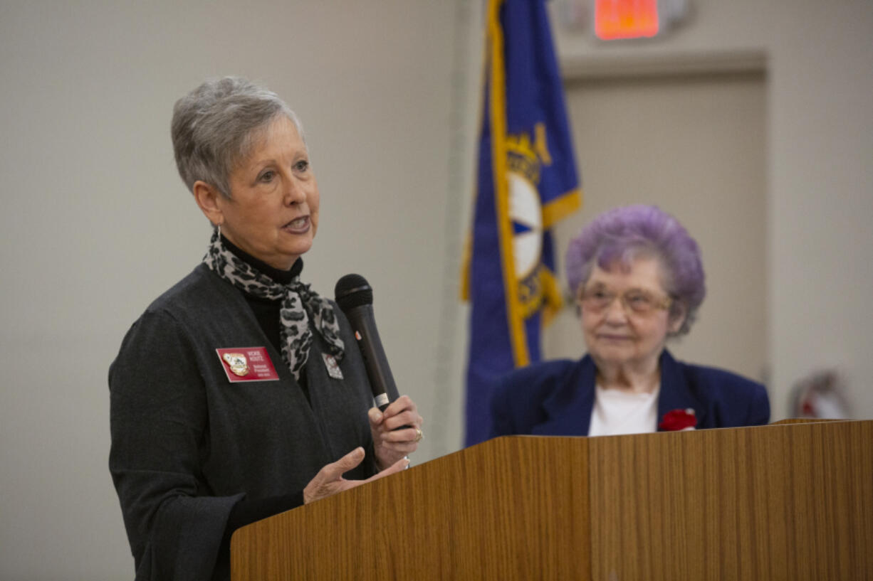 American Legion Auxiliary National President Vickie Koutz addresses a group of auxiliary members as Gloria Mack Cummings, Auxiliary Post 14 president, looks on (ELAYNA YUSSEN for The Columbian)