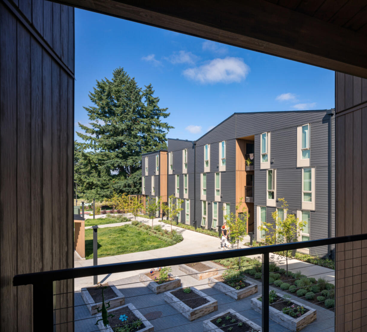 The Elwood permanent supportive housing complex has a community garden among other trauma-informed features designed by Access Architecture.