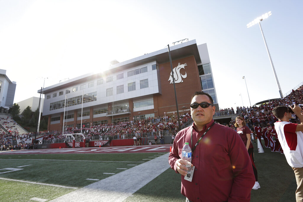 Washington State athletic director Pat Chun watches the first half of an NCAA college football game between Washington State and California, Saturday, Oct. 1, 2022, in Pullman, Wash.