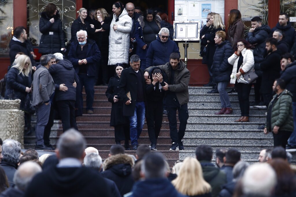 People react during the funeral procession of Athina Katsara, 34, a victim of the trains' collision, during her funeral procession in Katerini, about 433 kilometeres (270 miles) north of Athens, Greece, Friday, March 3, 2023. The funeral for the first of nearly 60 victims of Greece's worst rail disaster this week was held Friday as families began receiving the remains of their loved ones following a harrowing identification process.