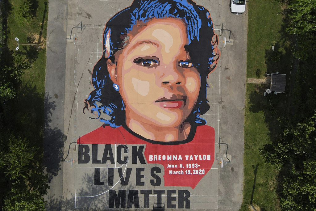 FILE - A ground mural depicting a portrait of Breonna Taylor is seen at Chambers Park in Annapolis, Md., July 6, 2020. The U.S. Justice Department has found Louisville police have engaged in a pattern of violating constitutional rights following an investigation prompted by the fatal police shooting of Taylor. The announcement was made Wednesday, March 8, 2023, by Attorney Merrick Garland.