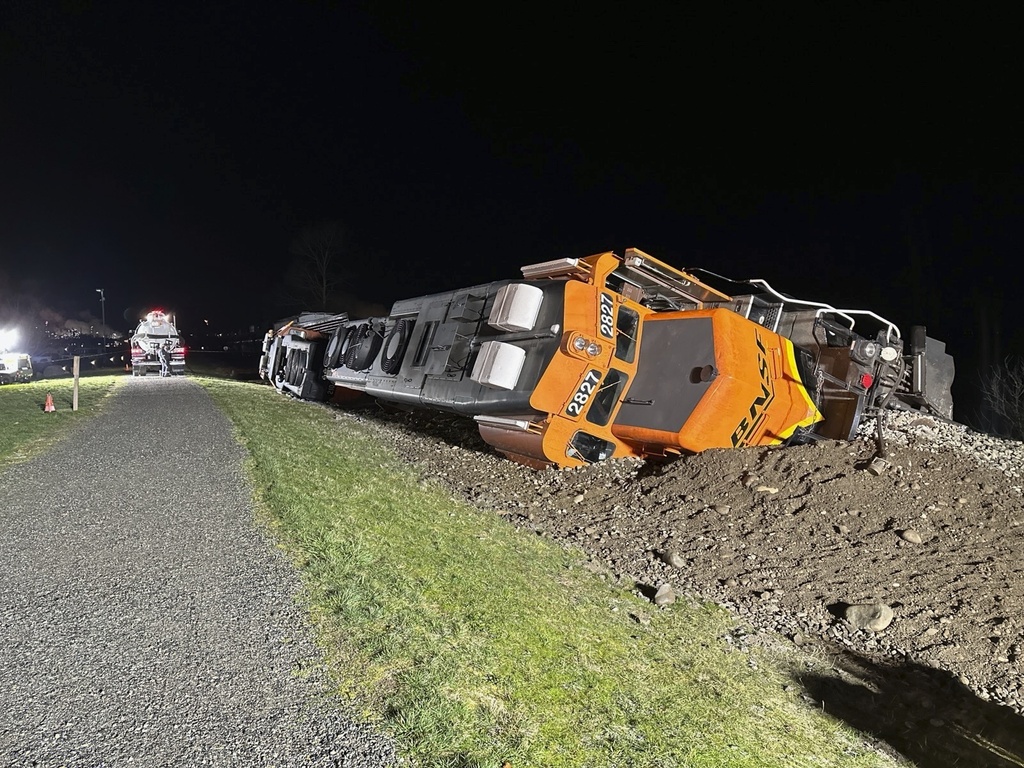 This photo provided by the Washington Department of Ecology shows a derailed BNSF train on the Swinomish tribal reservation near Anacortes, Wash. on Thursday, March 16, 2023. Two BNSF trains derailed in separate incidents in Arizona and Washington state on Thursday, with the latter spilling diesel fuel. There were no injuries reported in either. The derailment in Washington occurred on a berm along Puget Sound, on the Swinomish tribal reservation near Anacortes.