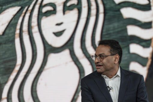 FILE - Incoming CEO Laxman Narasimhan speaks during Starbucks Investor Day 2022, Sept. 13, 2022, in Seattle. Starbucks officially has a new CEO. The Seattle coffee giant said Monday, March 20, 2023 that Laxman Narasimhan has assumed the role of CEO and joined the company’s board of directors.
