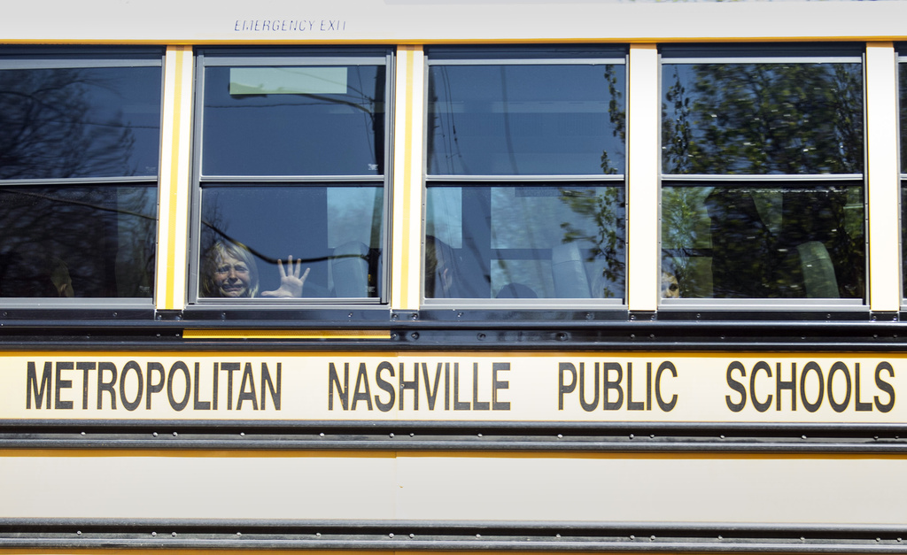 A child weeps while on the bus leaving The Covenant School following a mass shooting at the school in Nashville, Tenn., Monday, March 27, 2023.