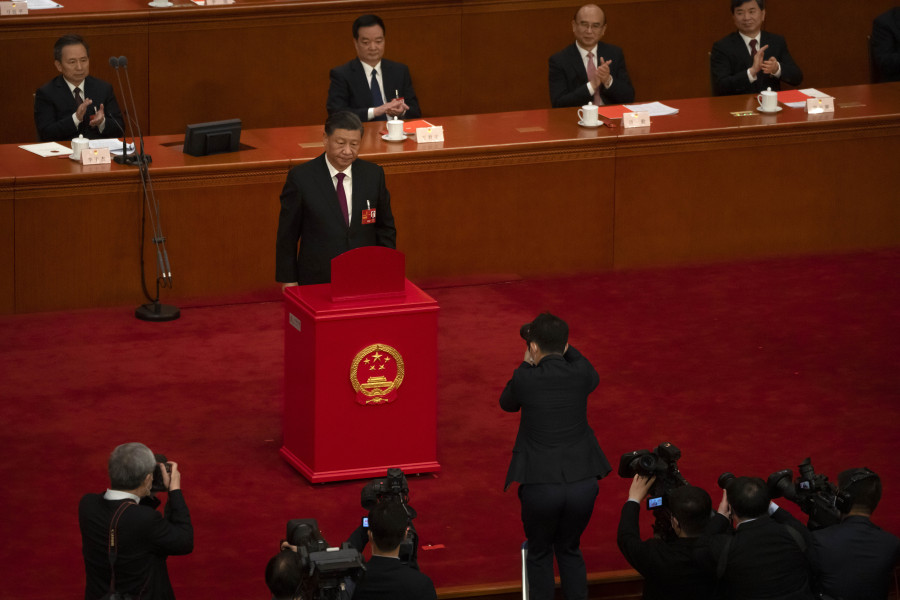 Chinese President Xi Jinping casts his vote during a session of China's National People's Congress (NPC) at the Great Hall of the People in Beijing, Friday, March 10, 2023. Chinese leader Xi Jinping was awarded a third five-year term as president Friday, putting him on track to stay in power for life at a time of severe economic challenges and rising tensions with the U.S. and others.