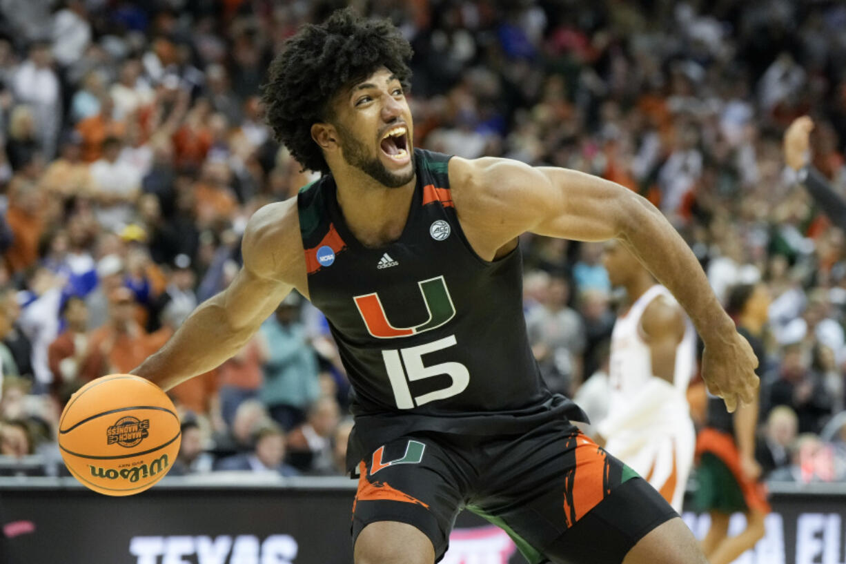 Miami forward Norchad Omier celebrates after their win against Texas in an Elite 8 college basketball game in the Midwest Regional of the NCAA Tournament Sunday, March 26, 2023, in Kansas City, Mo.