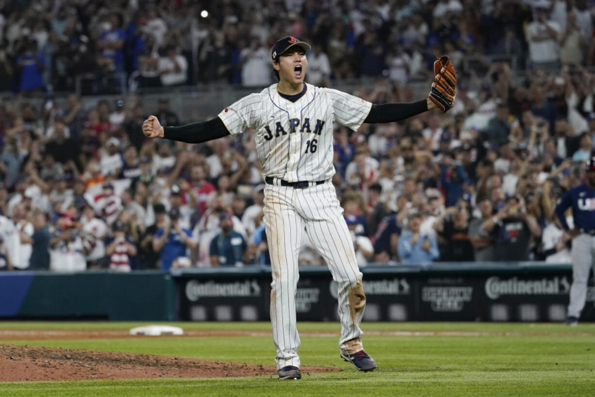 Japan pitcher Shohei Ohtani (16) celebrates after defeating the United States at the World Baseball Classic final game, Tuesday, March 21, 2023, in Miami.