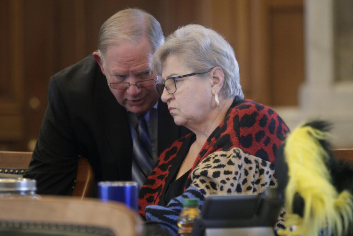 Kansas House Speaker Dan Hawkins, left, R-Wichita, confers with state Rep. Brenda Landwehr, R-Wichita, ahead of a House debate on a proposed "born-alive infants protection," law to apply to abortion providers, Tuesday, March 21, 2023, at the Statehouse in Topeka, Kan. Landwehr is chair of the House health committee, and it handled the measure, which would require providers to try to preserve the lives of infants born during unsuccessful abortions.