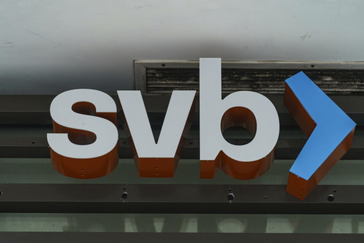 FILE - The Silicon Valley Bank logo is seen at an open branch in Pasadena, Calif., on March 13, 2023. A handful of red state Democrats were instrumental helping Republicans secure a rollback of banking regulations sought by then-President Donald Trump in 2018. Now those changes are being blamed for contributing to the recent collapse of Silicon Valley Bank and Signature Bank that prompted a federal rescue and stoked anxiety about a broader banking contagion.