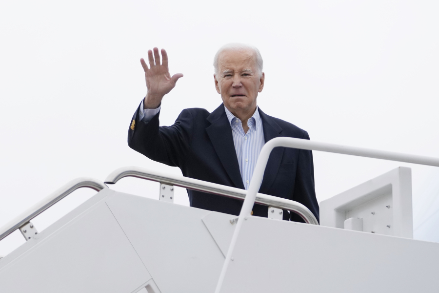 President Joe Biden waves as he boards Air Force One at Andrews Air Force Base, Md., Friday, March 31, 2023, en route to Rolling Fork, Miss., to meet with those impacted by last week's massive storm.