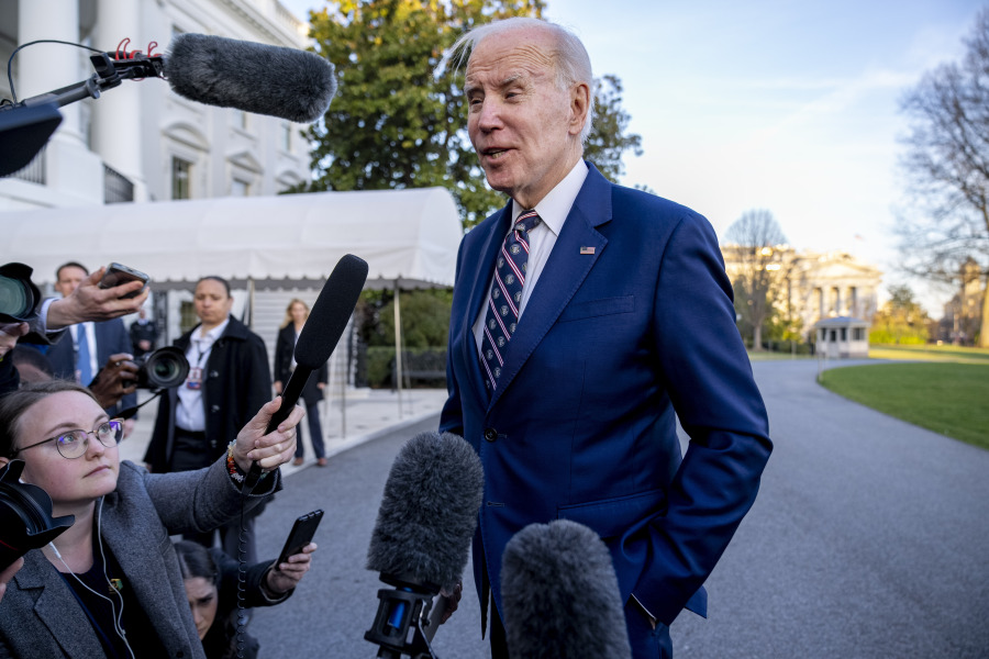President Joe Biden speaks with members of the media as he arrives back to the White House in Washington, Thursday, March 9, 2023, after traveling to Philadelphia.