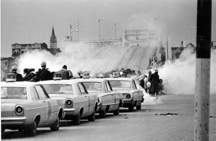 FILE - Tear gas fills the air as state troopers, ordered by Alabama Gov. George Wallace, break up a march at the Edmund Pettus Bridge in Selma, Ala., March 7, 1965, on what became known as Bloody Sunday. On Sunday, March 5, 2023, President Joe Biden is set to pay tribute to the heroes of "Blood Sunday," joining thousands for the annual commemoration of the seminal moment in the civil rights movement that led to passage of landmark voting rights legislation nearly 60 years ago.