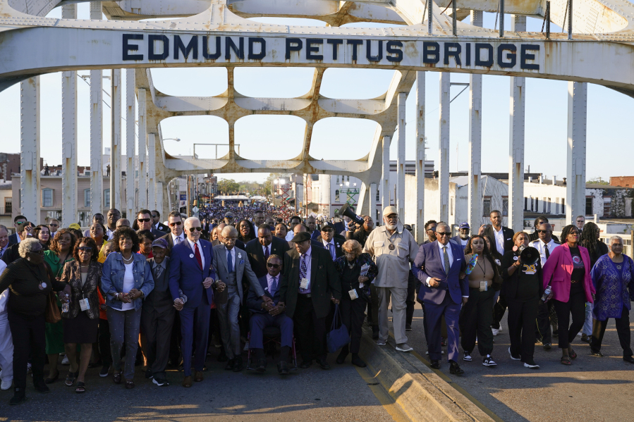 President Joe Biden walks across the Edmund Pettus Bridge in Selma, Ala., Sunday, March 5, 2023, to commemorate the 58th anniversary of "Bloody Sunday," a landmark event of the civil rights movement.