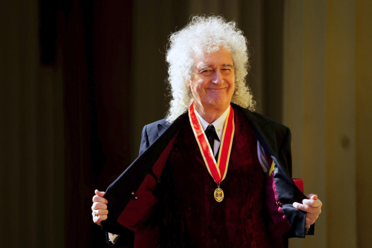 Sir Brian May, musician, songwriter and animal Welfare Advocate, poses after being made a Knight Bachelor by King Charles III during an investiture ceremony at Buckingham Palace, London, Tuesday March 14, 2023.
