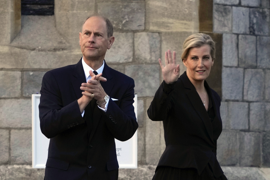 FILE - Britain's Prince Edward and Sophie, Countess of Wessex, wave to mourners outside the Windsor Castle in Windsor, England, on Sept. 16, 2022. Britain's King Charles III has made his youngest brother the Duke of Edinburgh, passing on a title held by their late father, Prince Philip. Buckingham Palace said the title was conferred on Prince Edward on Friday, March 10, 2023, his 59th birthday.