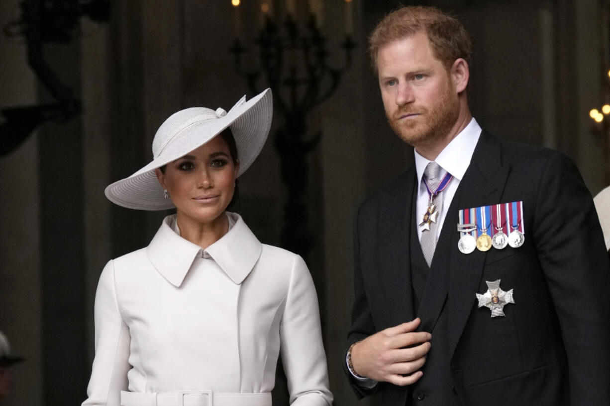 FILE - Prince Harry and Meghan Markle, Duke and Duchess of Sussex leave after a service of thanksgiving for the reign of Queen Elizabeth II at St Paul's Cathedral in London, Friday, June 3, 2022 on the second of four days of celebrations to mark the Platinum Jubilee. Prince Harry and his wife Meghan announced Wednesday, March 8, 2023 that their daughter had been christened in a private ceremony in California, publicly calling her a princess and revealing for the first time that they will use royal titles for their children.