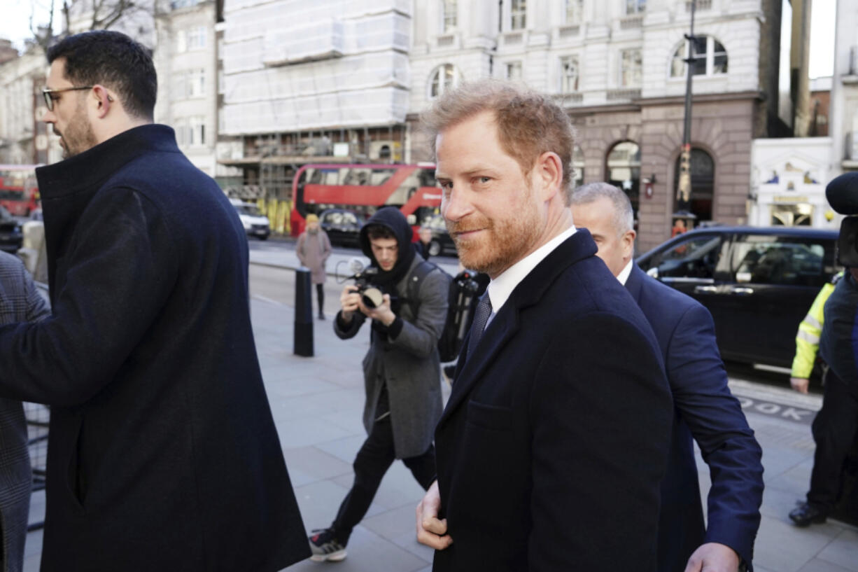 Prince Harry arrives at the Royal Courts Of Justice, in London, Monday, March 27, 2023. Prince Harry is in a London court as the lawyer for a group of British tabloids prepared to ask a judge to toss out lawsuits by the prince, Elton John and several other celebrities who allege phone tapping and other invasions of privacy.