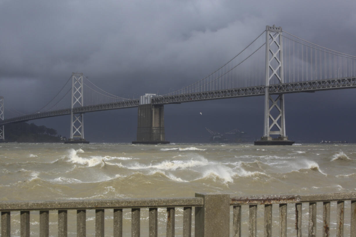 High winds create large waves along The Embarcadero near Pier 14 between Mission Street and Howard Street in San Francisco on Tuesday, March 21, 2023.