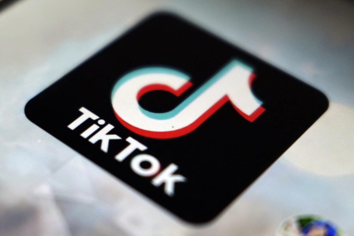 FILE - This photo shows a TikTok app logo in Tokyo on Sept. 28, 2020. In the latest salvo in the battle over the Chinese-owned video sharing app, Beijing says a ban on the use of TikTok by official European Union institutions will harm business confidence in Europe.