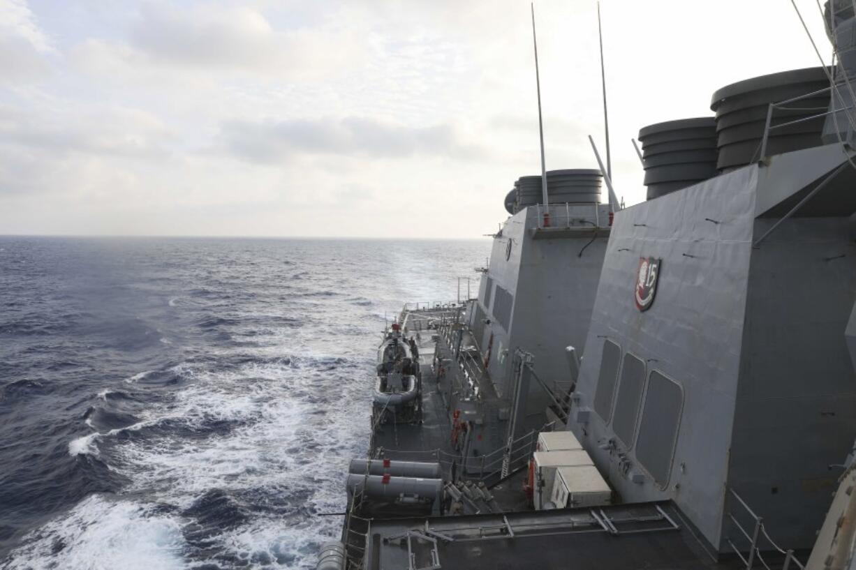 In this photo provided by the U.S. Navy, the Arleigh Burke-class guided-missile destroyer USS Milius (DDG 69) conducts routine underway operations in South China Sea, Friday March 24, 2023. China threatened "serious consequences" Friday, after the U.S. Navy sailed a destroyer around the disputed Paracel Islands in the South China Sea the second day in a row, which Beijing claimed was a violation of its sovereignty and security.(Mass Communication Specialist 1st Class Greg Johnson/U.S.