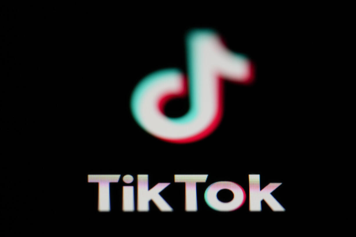 FILE - The icon for the video sharing TikTok app is seen on a smartphone, on Feb. 28, 2023. China appealed Friday, March 17, 2023, to other governments to treat its companies fairly after Britain and New Zealand joined the United States in restricting use of TikTok due to fears the Chinese-owned short video service might be a security risk.