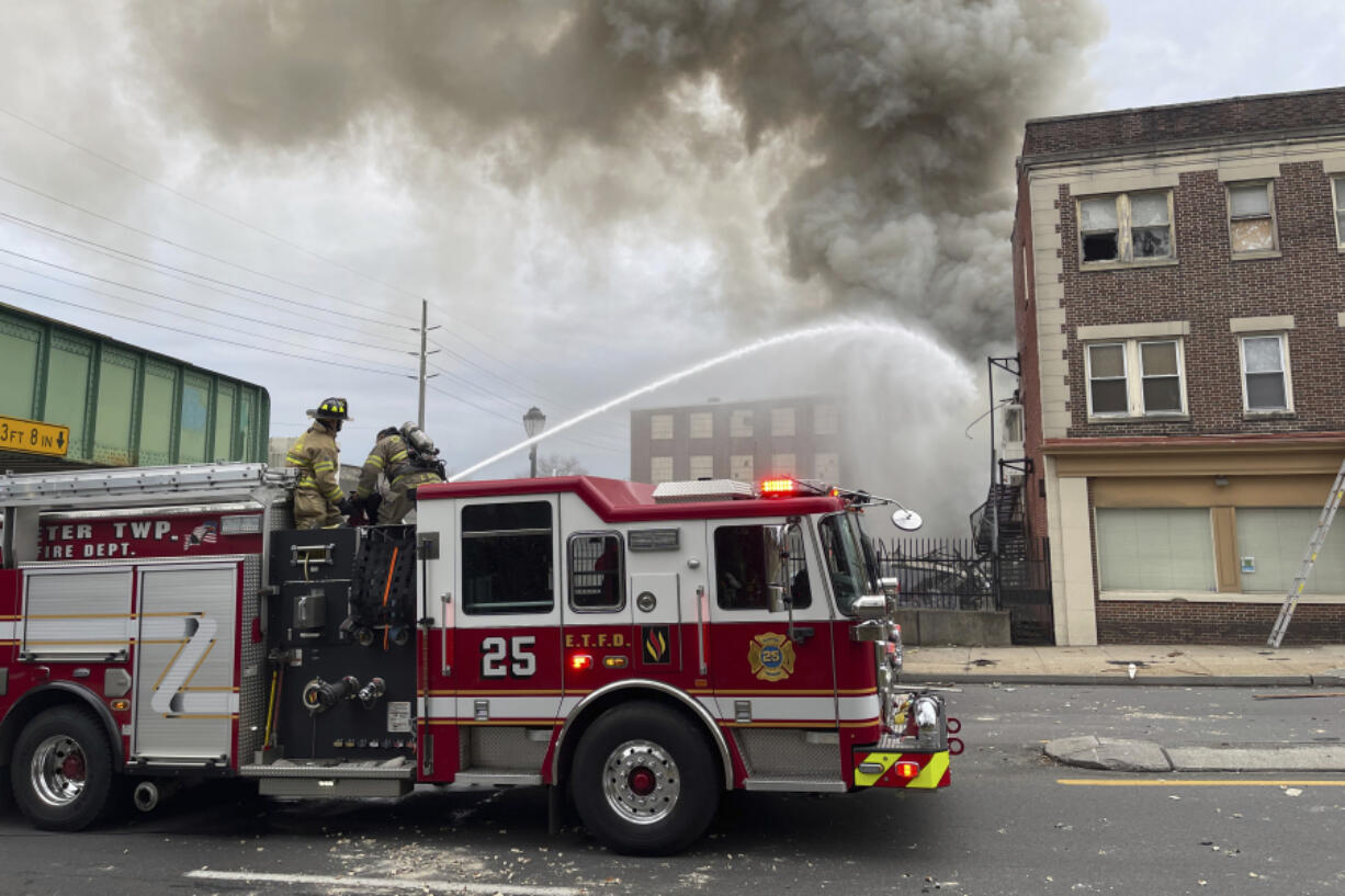 Emergency personnel work at the site of a deadly explosion at a chocolate factory in West Reading, Pa., Friday, March 24, 2023.
