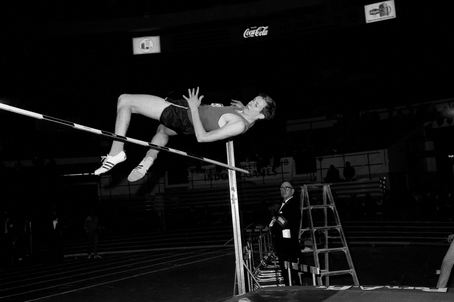 Dick Fosbury of Oregon State tries a seven foot two inch high jump with his head first style in the New York Athletic club track meet at Madison Square Garden in New York, Feb. 17, 1968. Fosbury, the lanky leaper who completely revamped the technical discipline of high jump and won an Olympic gold medal with his "Fosbury Flop," has died after a recurrence with lymphoma. Fosbury died Sunday, March 12, 2023, according to his publicist, Ray Schulte. He was 76.