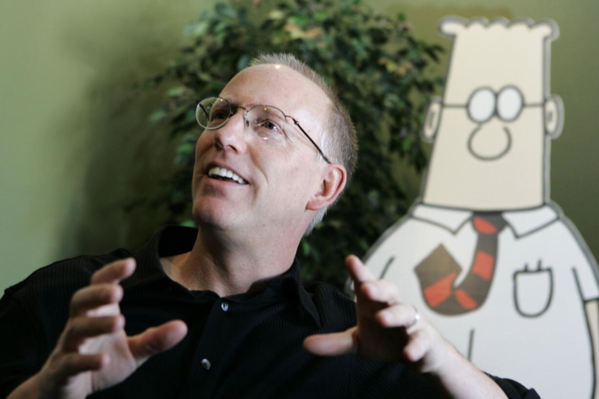 FILE - Scott Adams, creator of the comic strip Dilbert, talks about his work at his studio in Dublin, Calif., on Oct. 26, 2006. Adams experienced possibly the biggest repercussion of his recent comments about race when distributor Andrews McMeel Universal announced Sunday, Feb. 26 it would no longer work with the cartoonist. In an episode of his YouTube show last week, Adams described people who are Black as members of "a hate group" from which white people should "get away." Various media publishers across the U.S. denounced the comments while saying they would no longer provide a platform for his work.