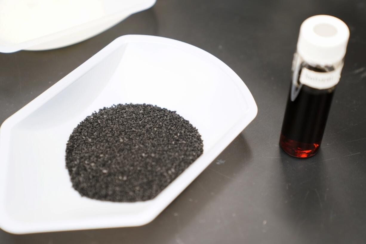 A sample of granular activated carbon, used to remove PFAS from water, sits on display during a tour of the U.S. Environmental Protection Agency Center For Environmental Solutions and Emergency Response, Tuesday, Feb. 14, 2023, in Cincinnati. The Environmental Protection Agency is expected to propose restrictions on harmful "forever chemicals" in drinking water after finding they are dangerous in amounts so small as to be undetectable, but experts say removing them will cost billions. (AP Photo/Joshua A.