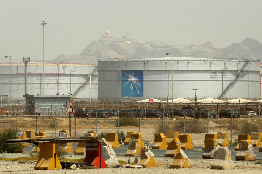 FILE - Storage tanks are seen at the North Jiddah bulk plant, an Aramco oil facility, in Jiddah, Saudi Arabia, on March 21, 2021.
