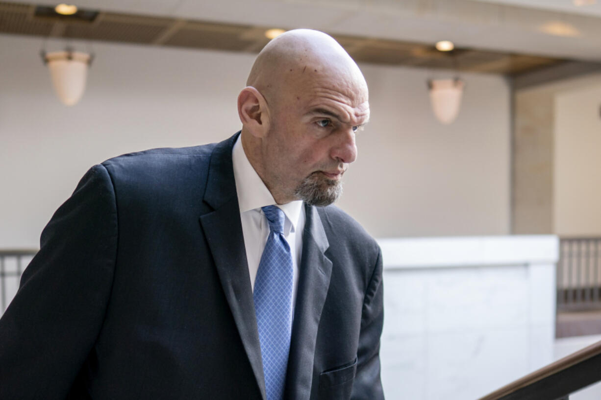 FILE - Sen. John Fetterman, D-Pa., leaves an intelligence briefing on the unknown aerial objects the U.S. military shot down this weekend at the Capitol in Washington, Feb. 14, 2023. Fetterman's office expects him to return soon to the chamber, although Democratic leaders are giving no timeline five weeks after he sought inpatient treatment for clinical depression. (AP Photo/J.