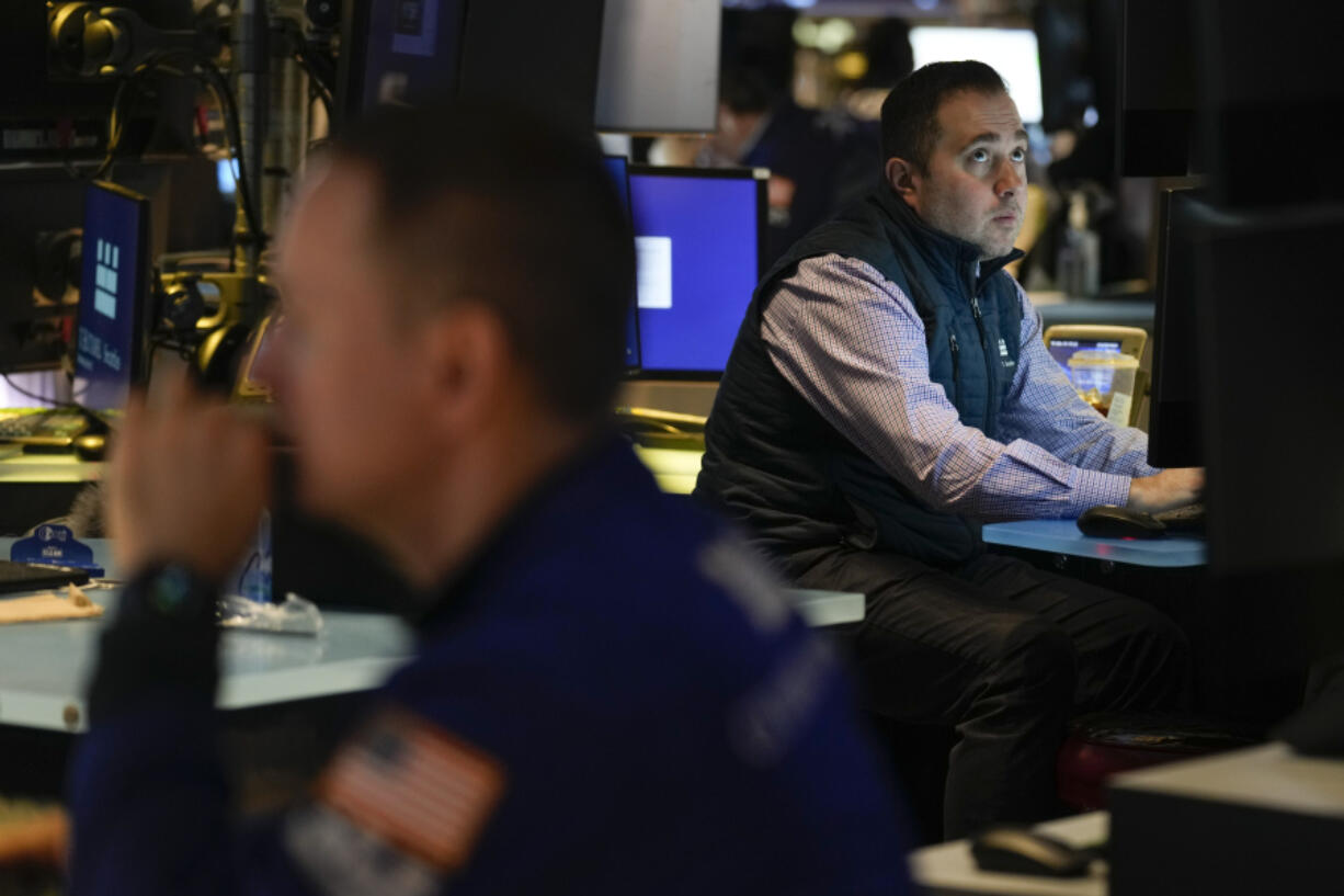 Traders work on the floor at the New York Stock Exchange in New York, Wednesday, March 15, 2023.  Stocks are falling on Wall Street as worries worsen about the strength of banks on both sides of the Atlantic.