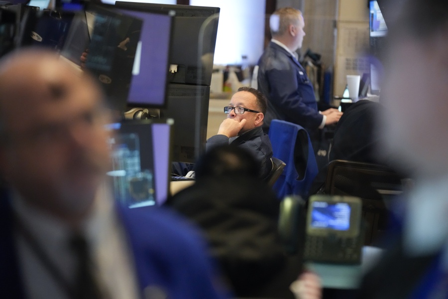 Traders work on the floor at the New York Stock Exchange in New York, Wednesday, Feb. 22, 2023.