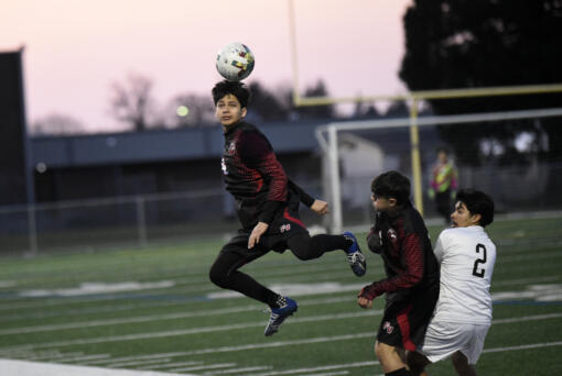 Edgar Sanchez Lopez of Fort Vancouver heads the ball during the Trappers’ 3-2 win over Hudson’s Bay on Thursday, March 16, 2023.