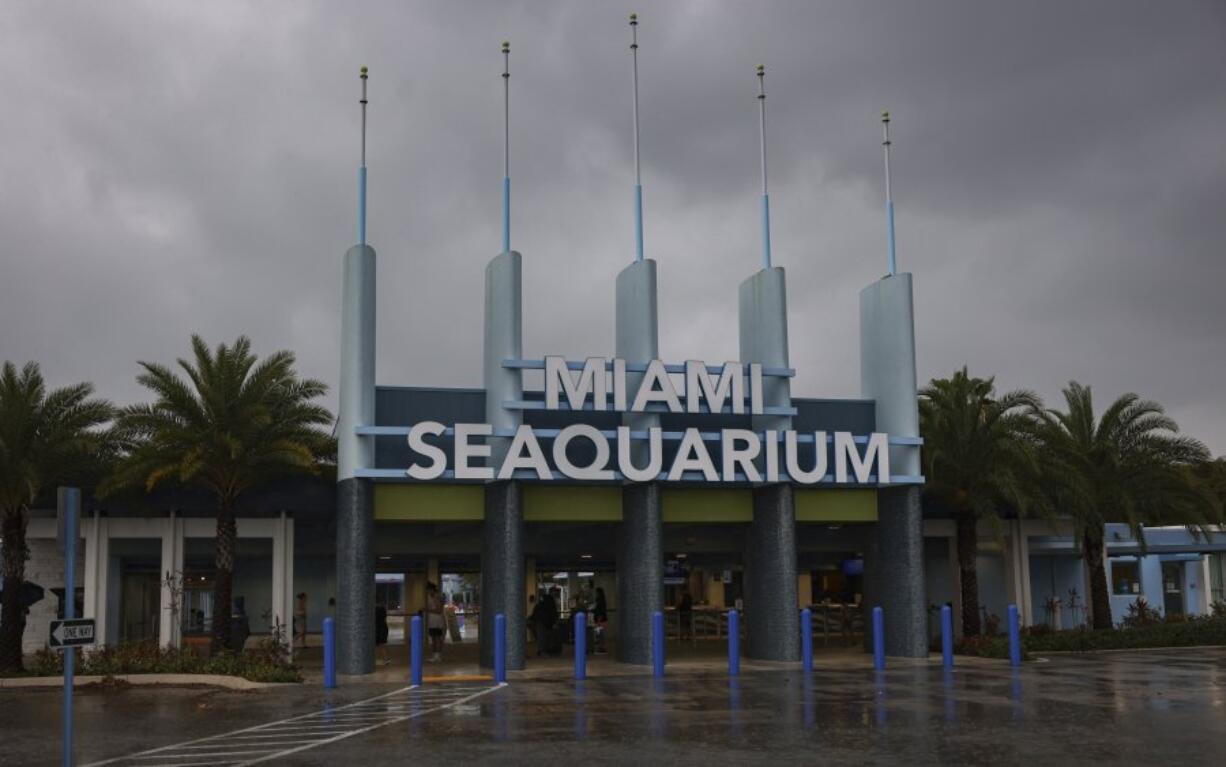 The entrance to Miami Seaquarium is seen, Thursday, March 30, 2023, in Miami. An unlikely coalition of a theme park owner, animal rights group and NFL owner-philanthropist announced Thursday that a plan is in place to return Lolita, an orca that has lived at the Miami Seaquarium for more than 50 years, to her home waters in the Pacific Northwest.
