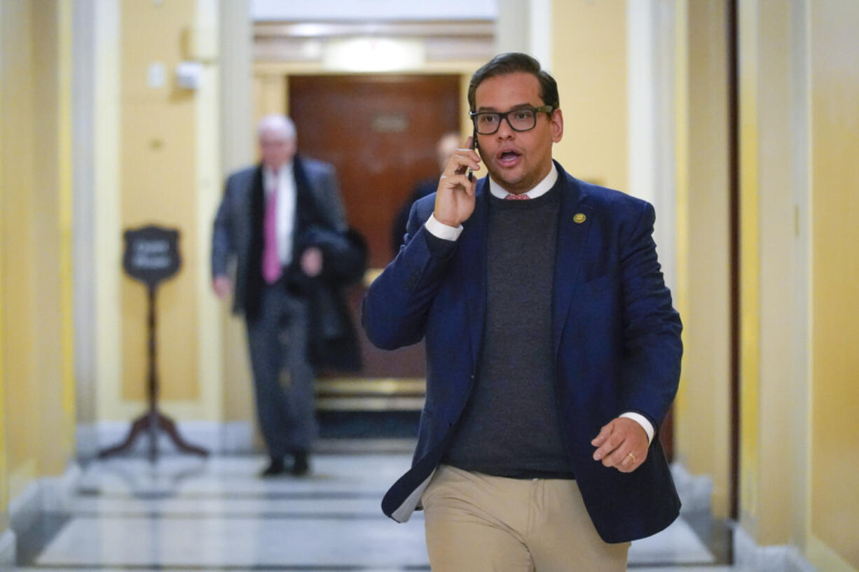 FILE - Rep. George Santos, R-N.Y., departs Capitol Hill in Washington, Jan. 11, 2023. Santos is carrying on in Congress despite calls for him to resign. Santos admitted to fabricating many aspects of his life story, but the newly elected congressman is refusing calls to quit.