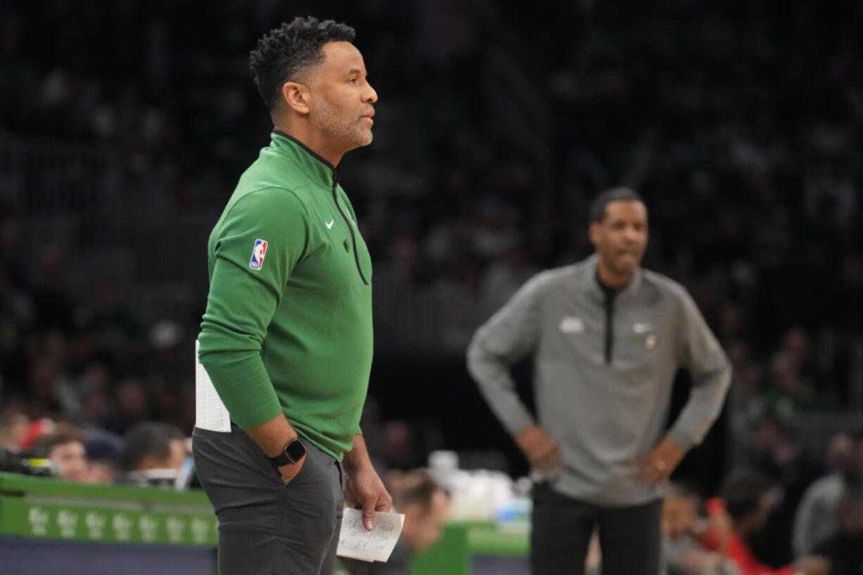 FILE - Boston Celtics assistant coach Damon Stoudamire, filling in for interim head coach Joe Mazzulla, draws up a play during a time out in the first half of an NBA basketball game against the Houston Rockets on Dec. 27, 2022, in Boston. Stoudamire was hired Monday, March 13, 2023, as Georgia Tech's men's basketball coach.