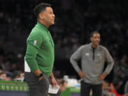 FILE - Boston Celtics assistant coach Damon Stoudamire, filling in for interim head coach Joe Mazzulla, draws up a play during a time out in the first half of an NBA basketball game against the Houston Rockets on Dec. 27, 2022, in Boston. Stoudamire was hired Monday, March 13, 2023, as Georgia Tech's men's basketball coach.