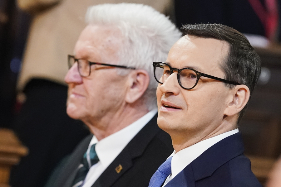 Poland's Prime Minister Mateusz Morawiecki, right, arrives with the Prime Minister of German federal state Baden W?rttemberg Winfried Kretschmann, left, at the Old Assembly Hall to deliver his speech about the 'Future Of Europe' at the University in Heidelberg, Germany, Monday, March 20, 2023.