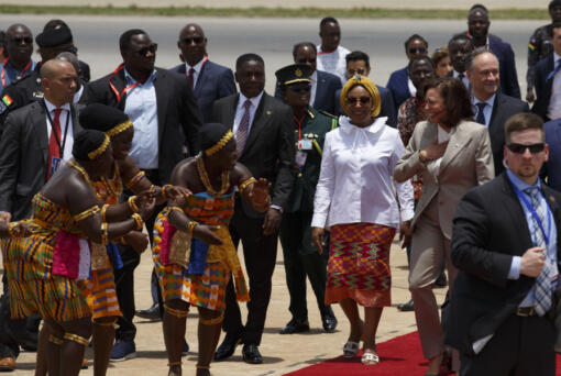 U.S. Vice President Kamala Harris is greeted by traditional dancers as she arrives in Accra, Ghana, Sunday March 26, 2023. Harris is on a seven-day African visit that will also take her to Tanzania and Zambia.