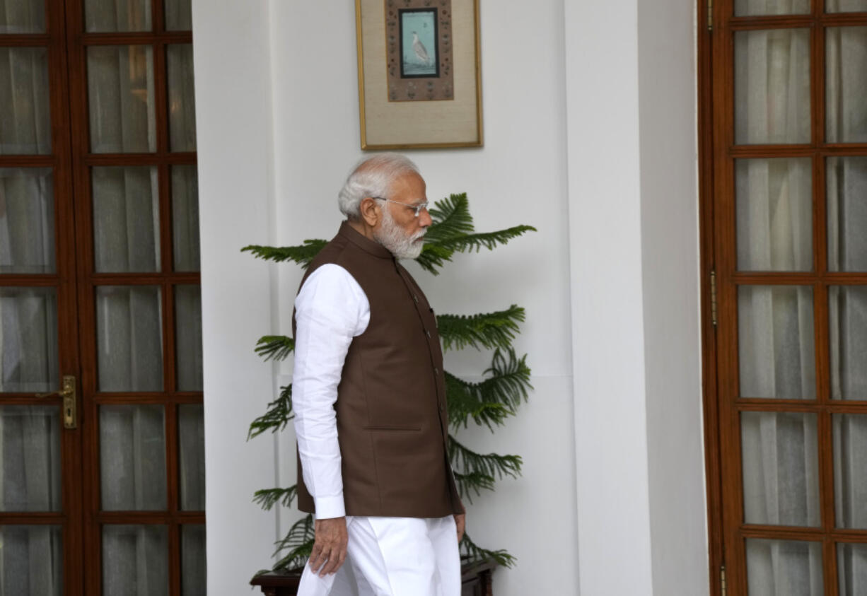 Indian Prime Minister Narendra Modi arrives to receive his Japanese counterpart Fumio Kishida before their delegation level meeting in New Delhi, India, Monday, March 20, 2023.