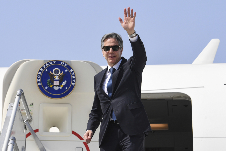 U.S. Secretary of State Antony Blinken waves as he boards his plane at New Delhi Airport to depart for Washington, D.C. from New Delhi, India, Friday, March 3, 2023.